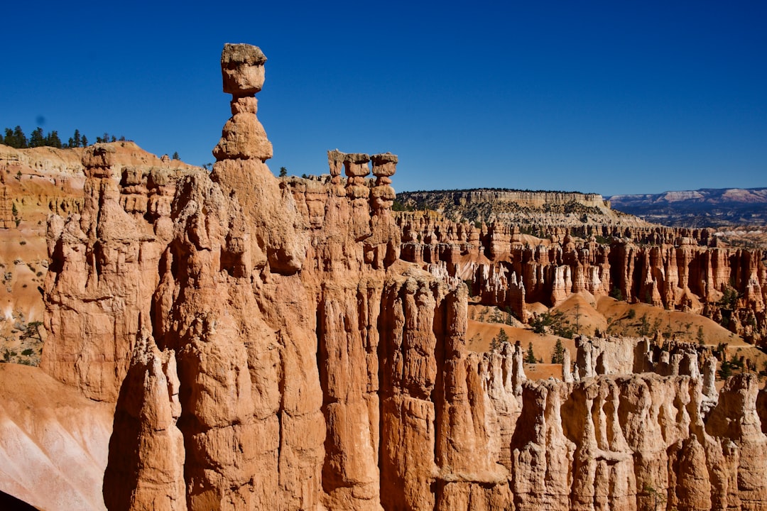 brown rock formation under blue sky during daytime