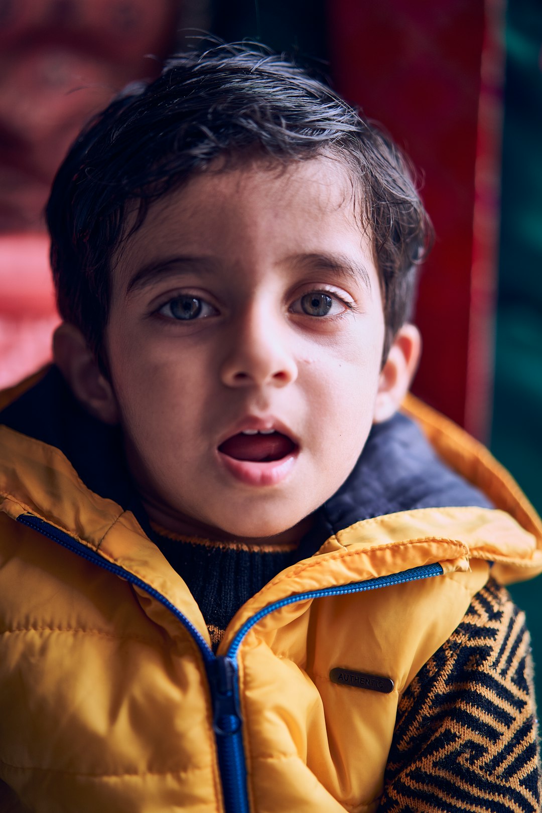 boy in yellow zip up jacket