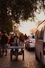 people standing near cars during daytime
