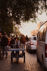 people standing near cars during daytime