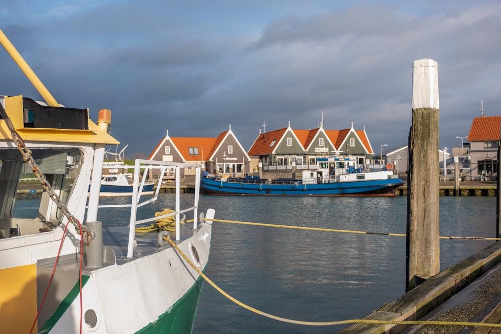 blue and white boat on sea during daytime