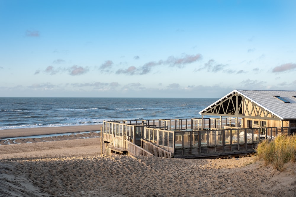 brown wooden dock on beach during daytime