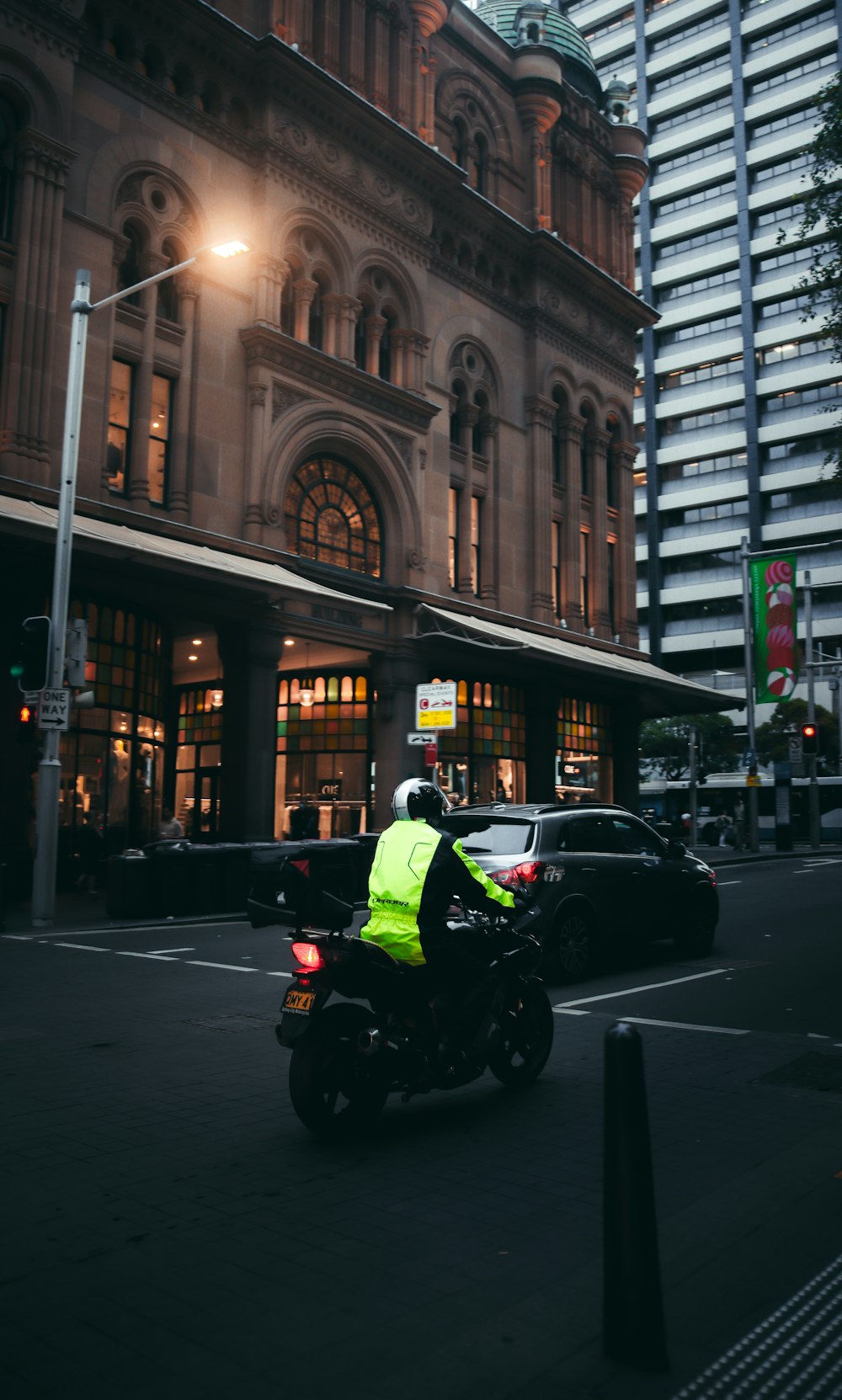 man in green jacket riding on black motorcycle