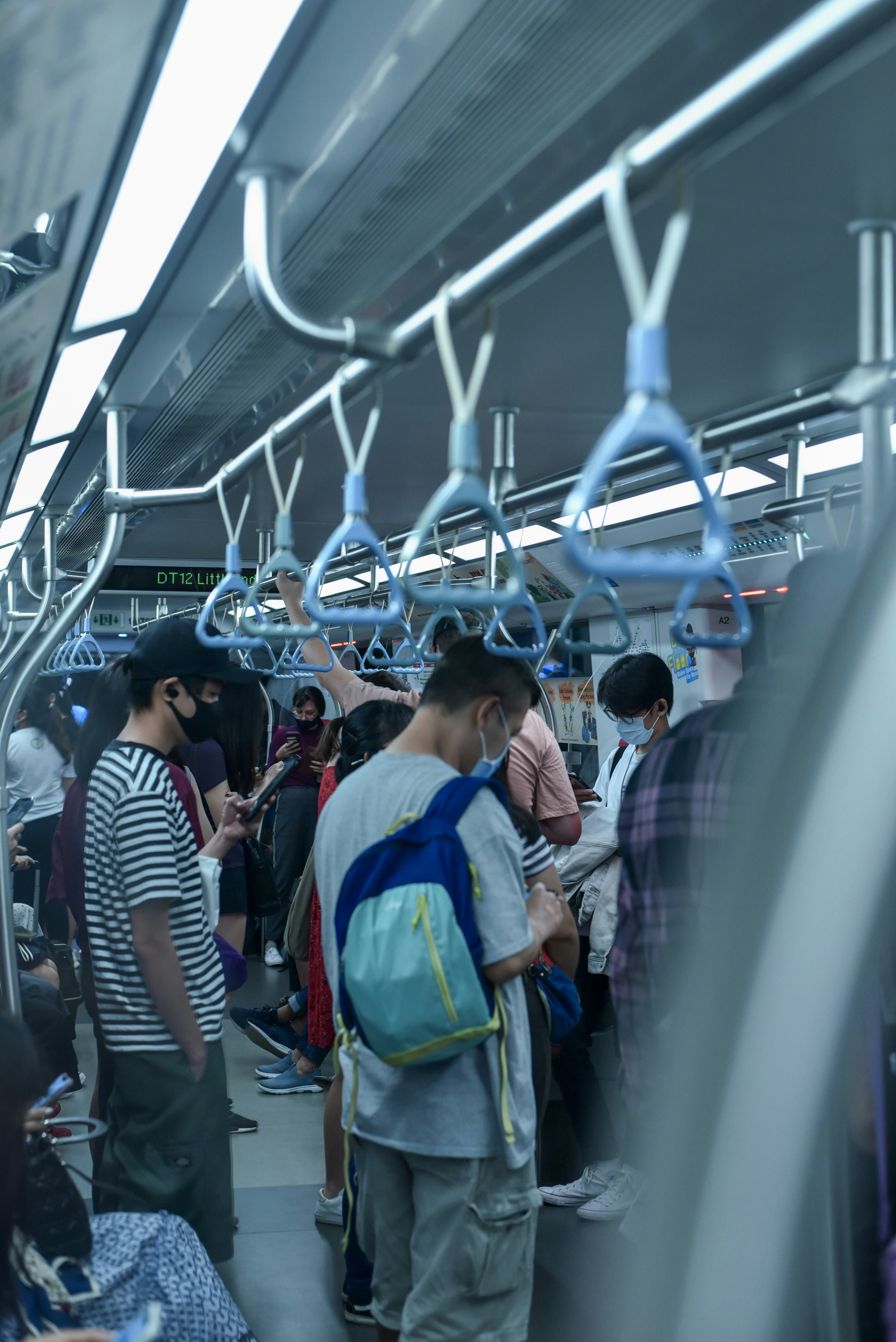 people in a train during daytime