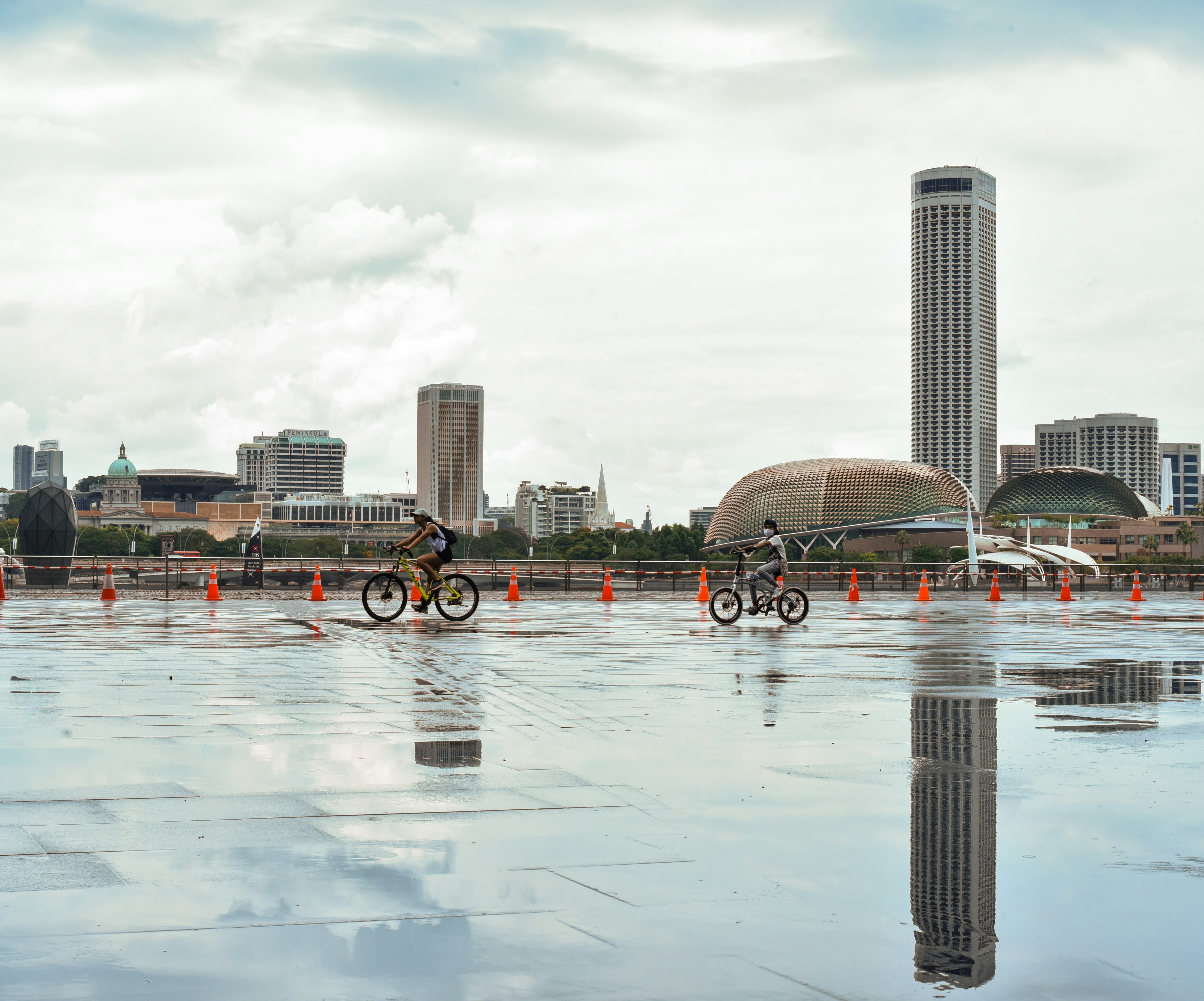 black and white boat on water near city buildings during daytime