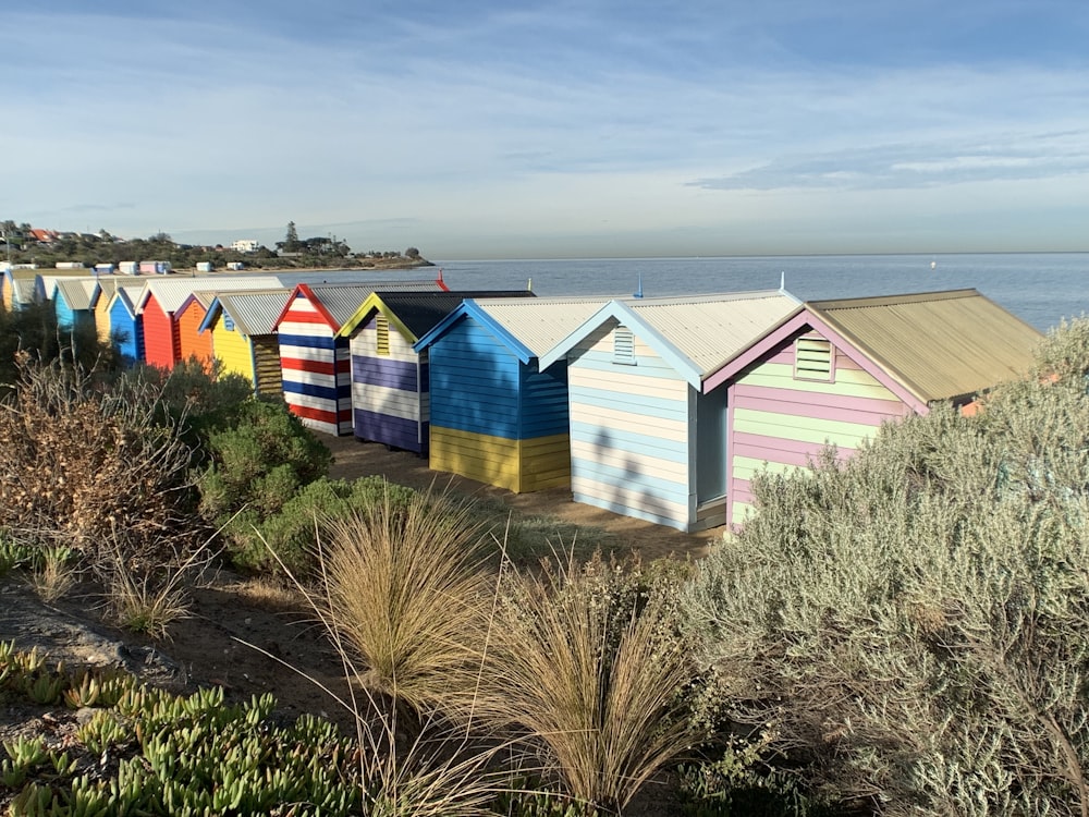 yellow blue and red houses under blue sky during daytime