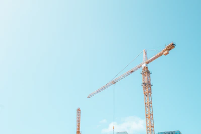 orange crane under white sky