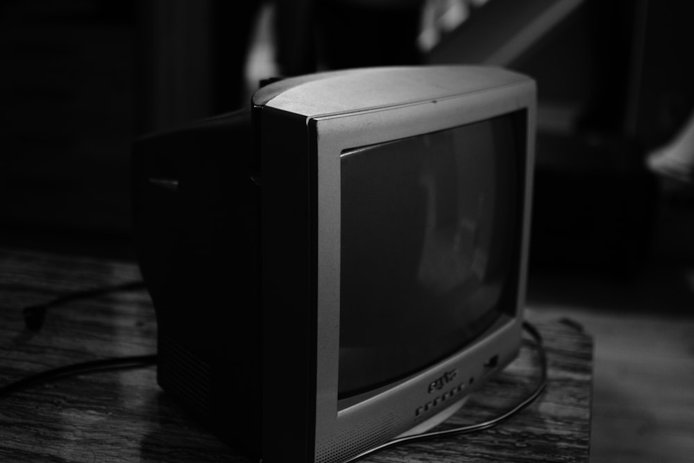 gray crt tv on brown wooden table