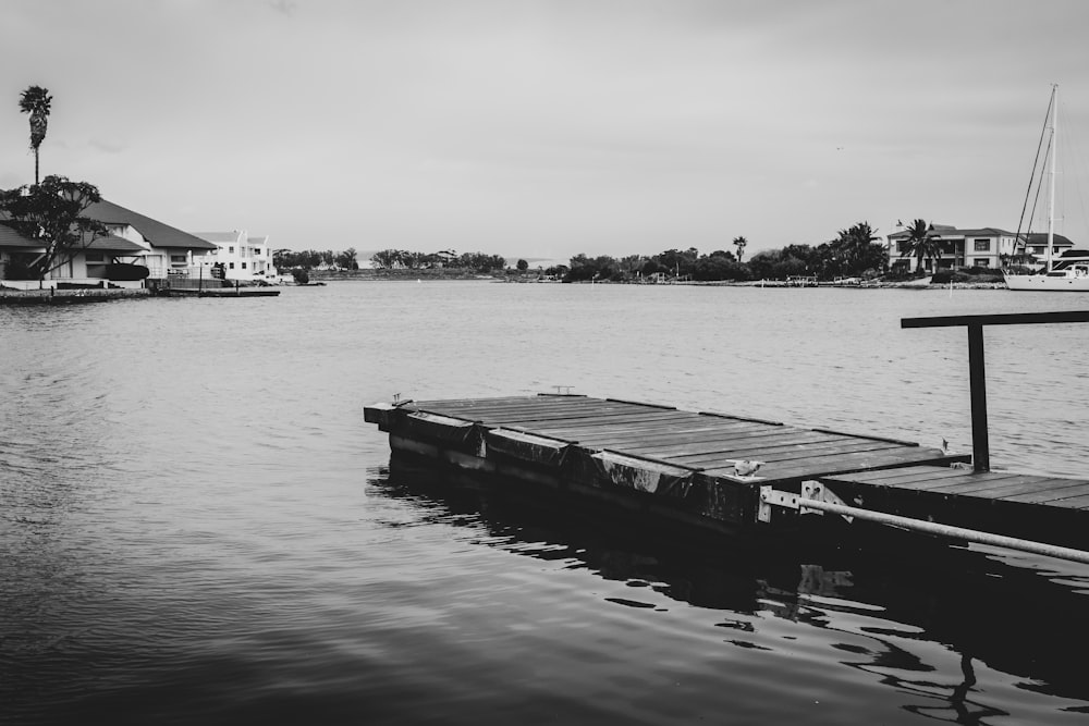 grayscale photo of boat on water