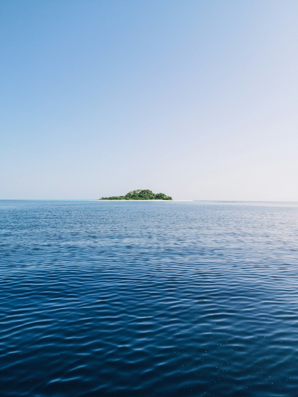 green island in the middle of ocean