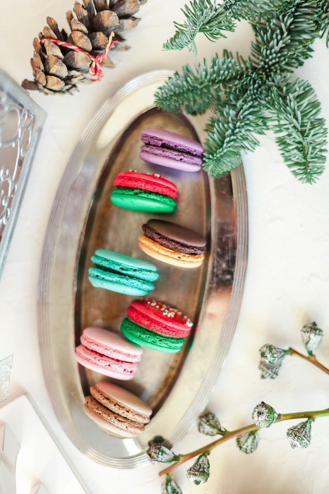 pink green and white candy on clear glass plate