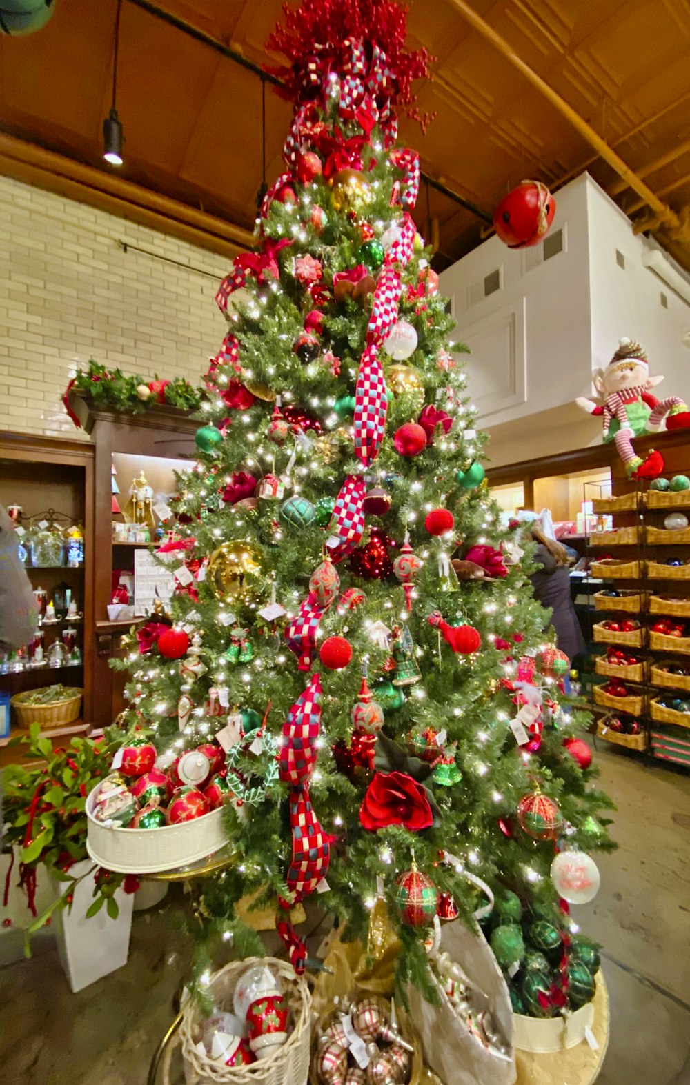 green and red christmas tree with baubles