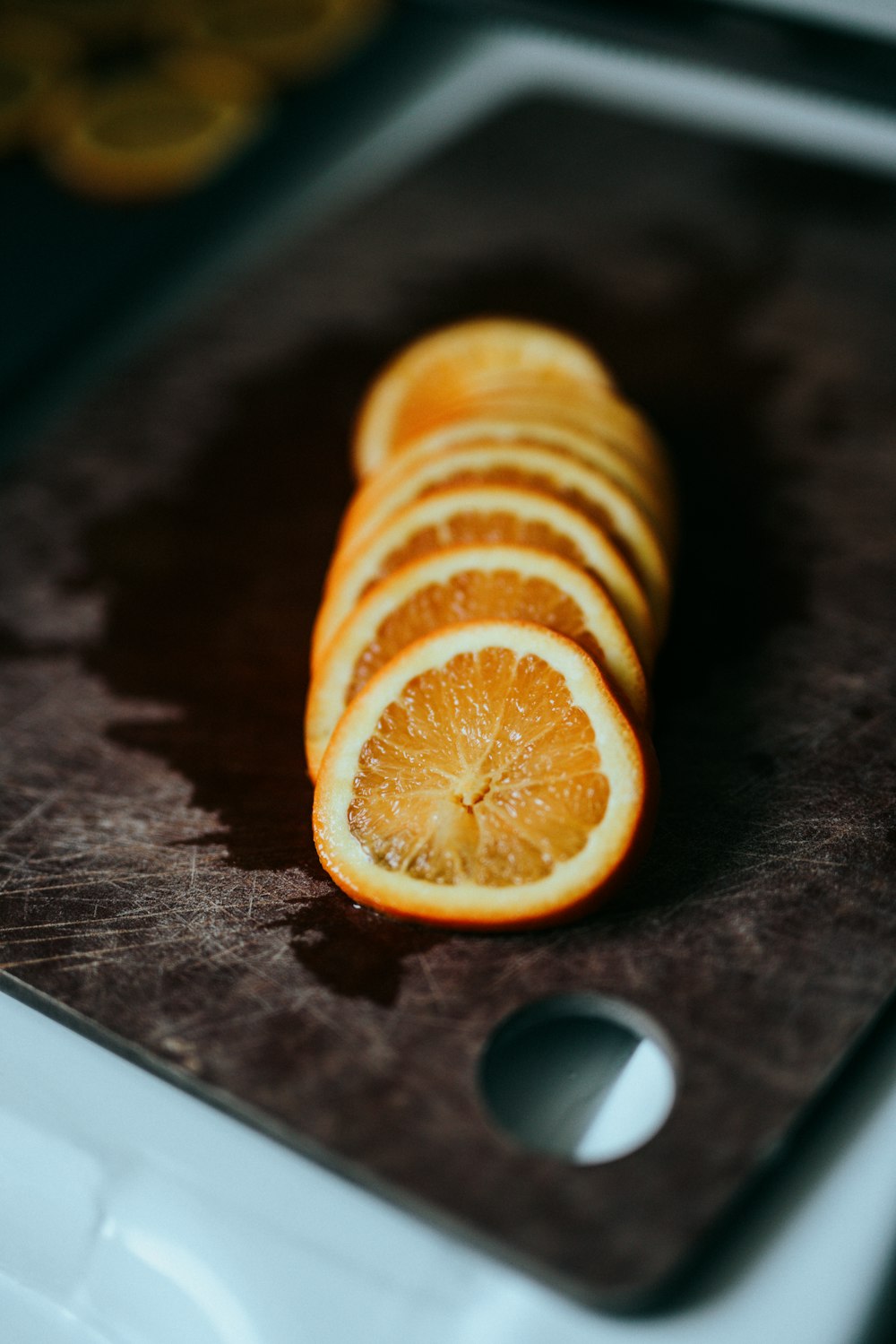 sliced lemon on brown wooden table