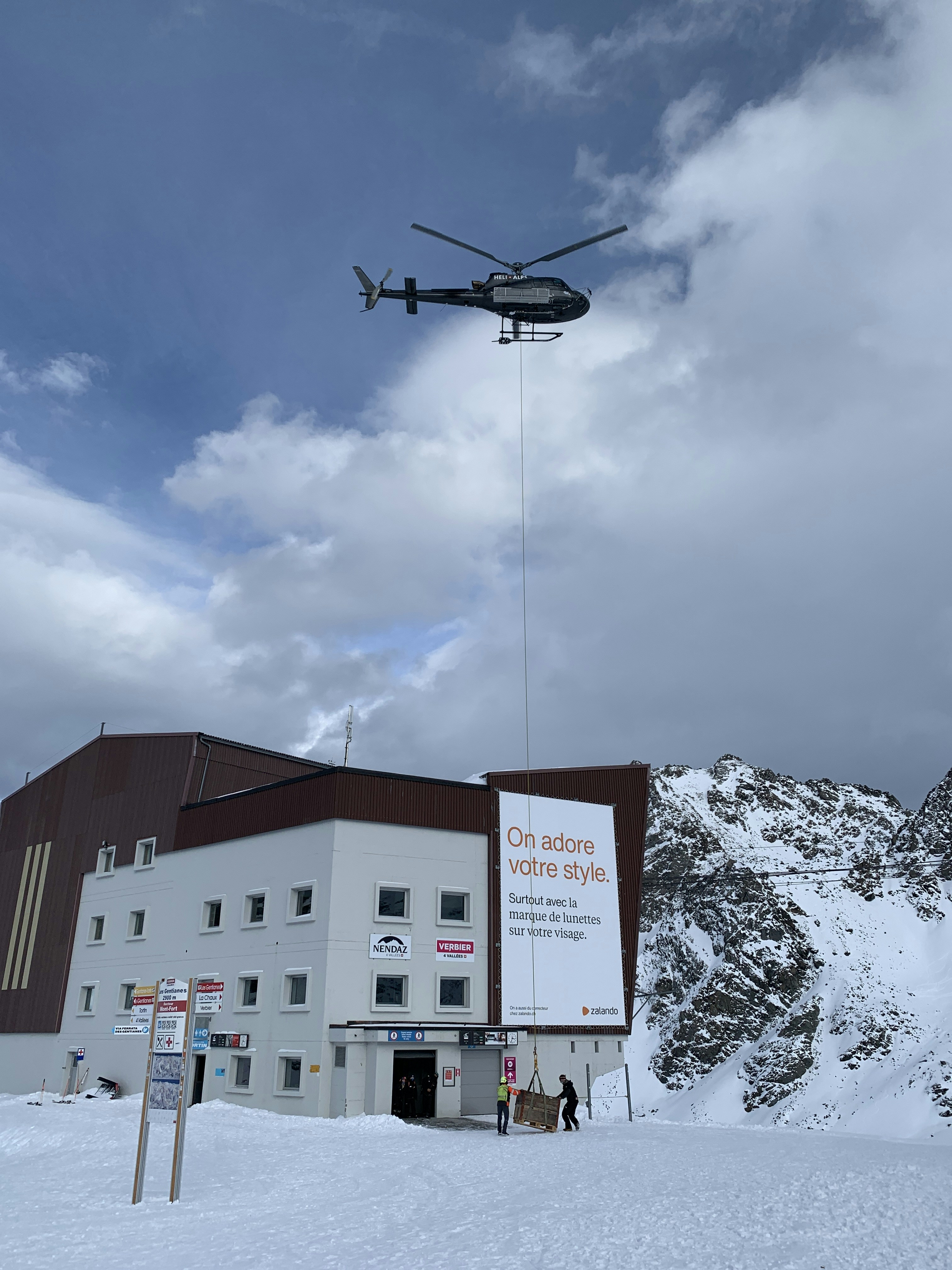 helicopter delivering pallet in Verbier Switzerland