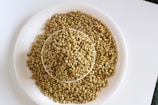 brown beans on white ceramic plate