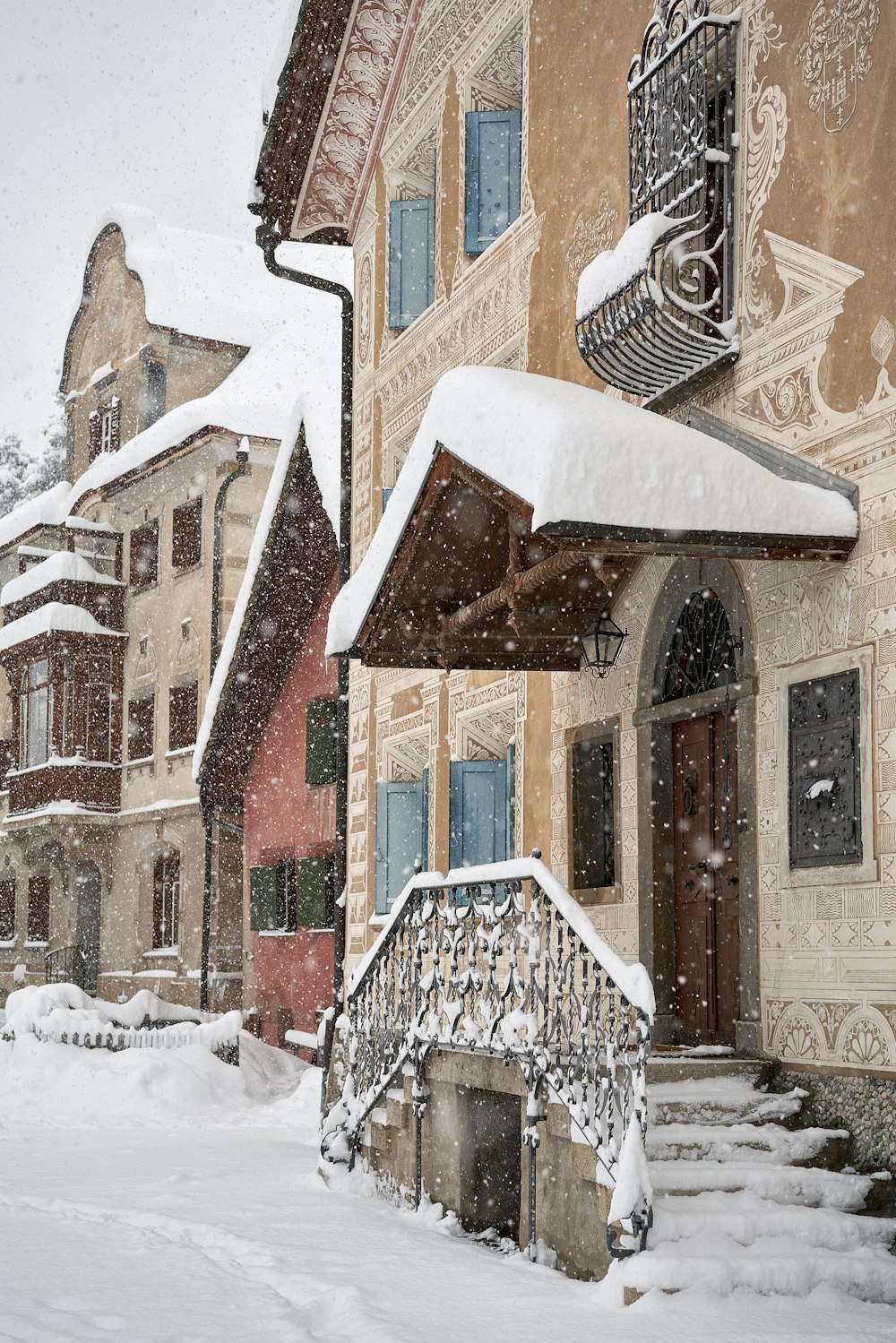 brown and white concrete building covered with snow