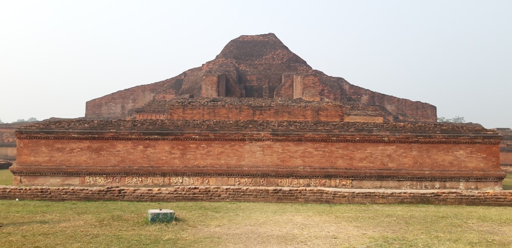 brown rock formation under white sky during daytime