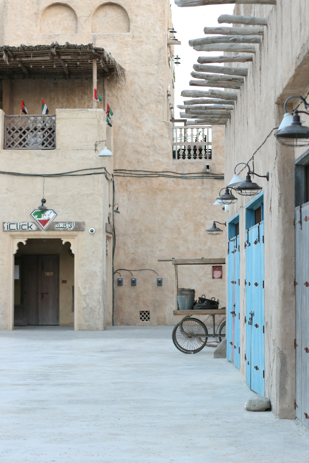 black bicycle parked beside blue wooden door