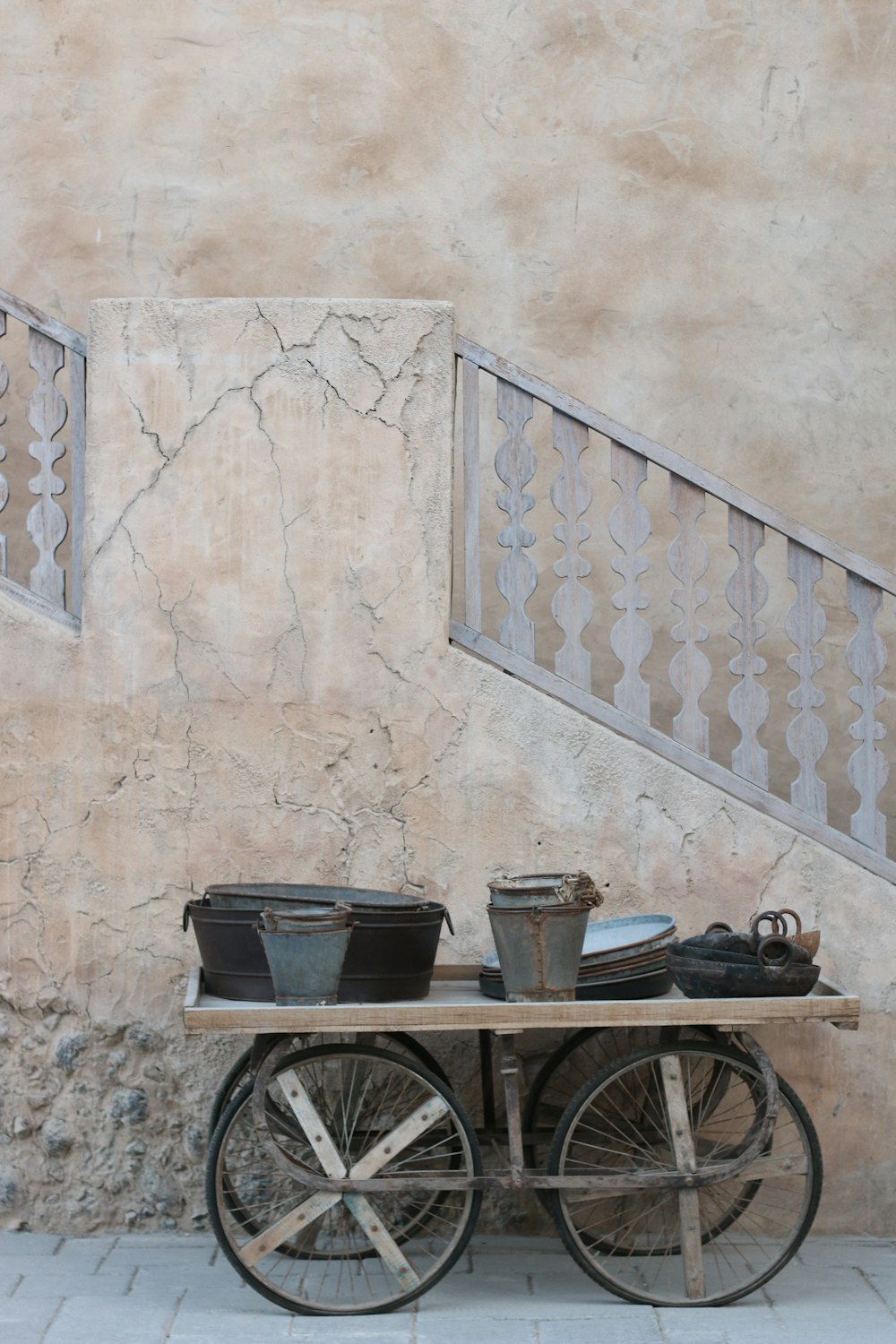 black city bike beside brown concrete wall