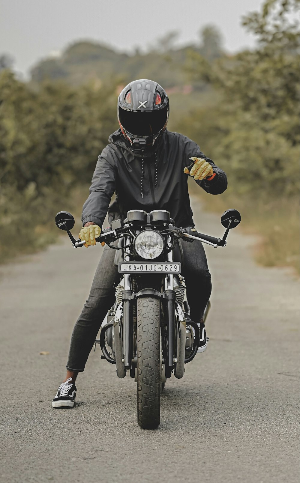 man in black motorcycle helmet riding motorcycle during daytime