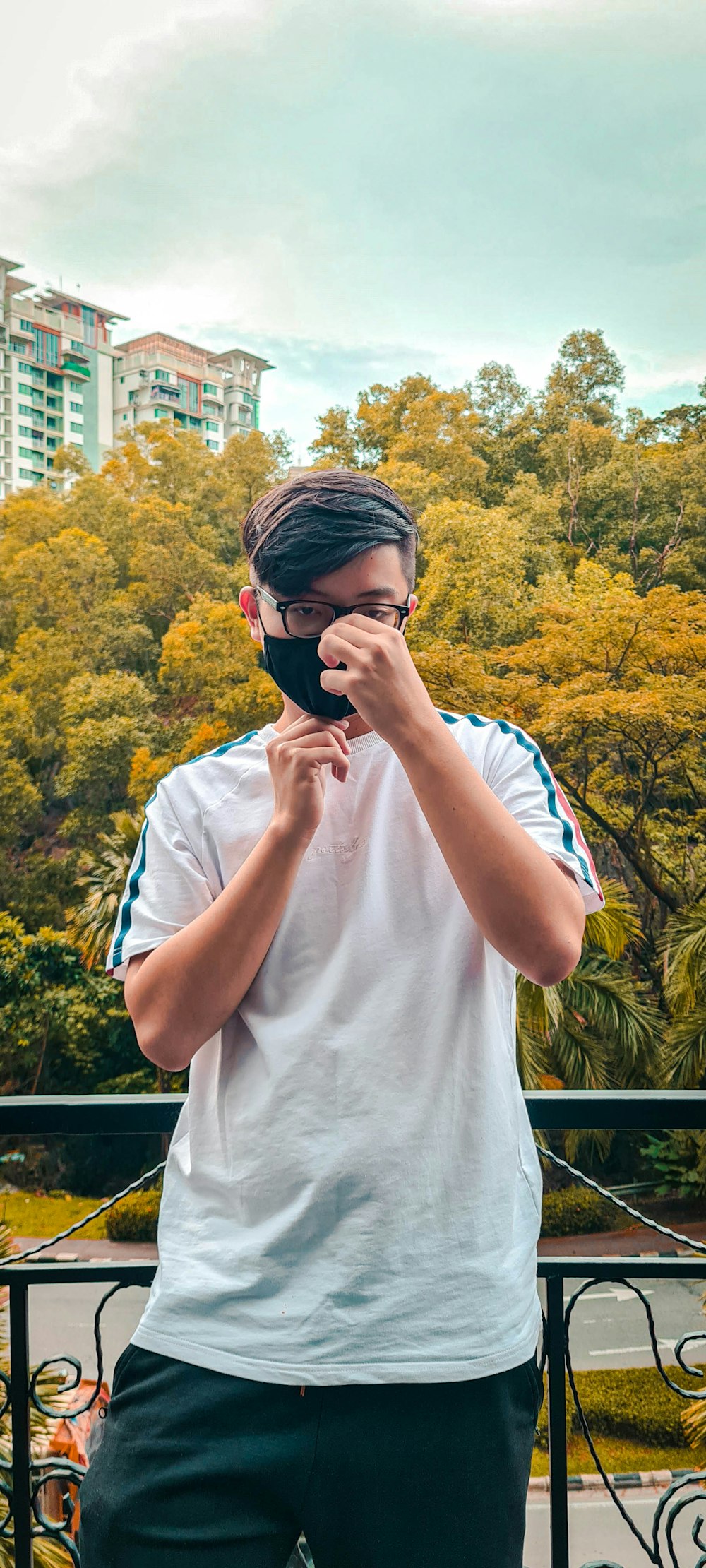 man in white crew neck t-shirt wearing black sunglasses