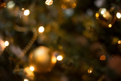gold and white baubles in tilt shift lens merry teams background