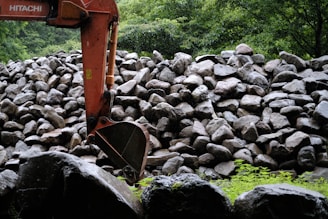 orange metal machine on gray rocks