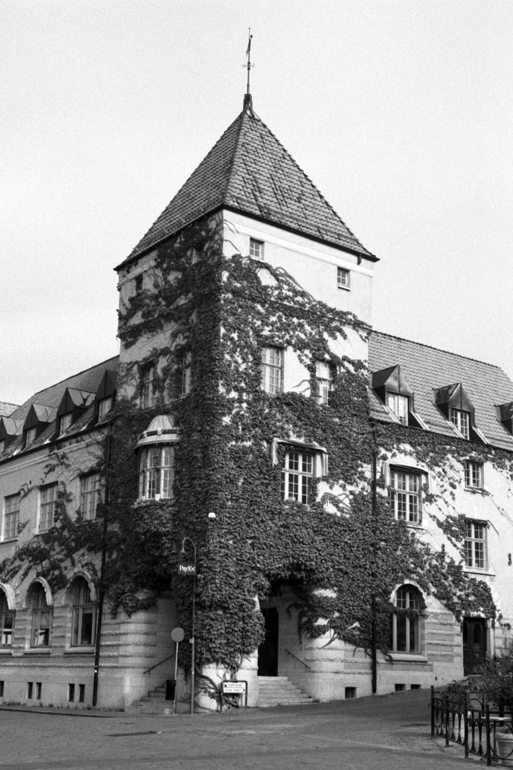 grayscale photo of brick building