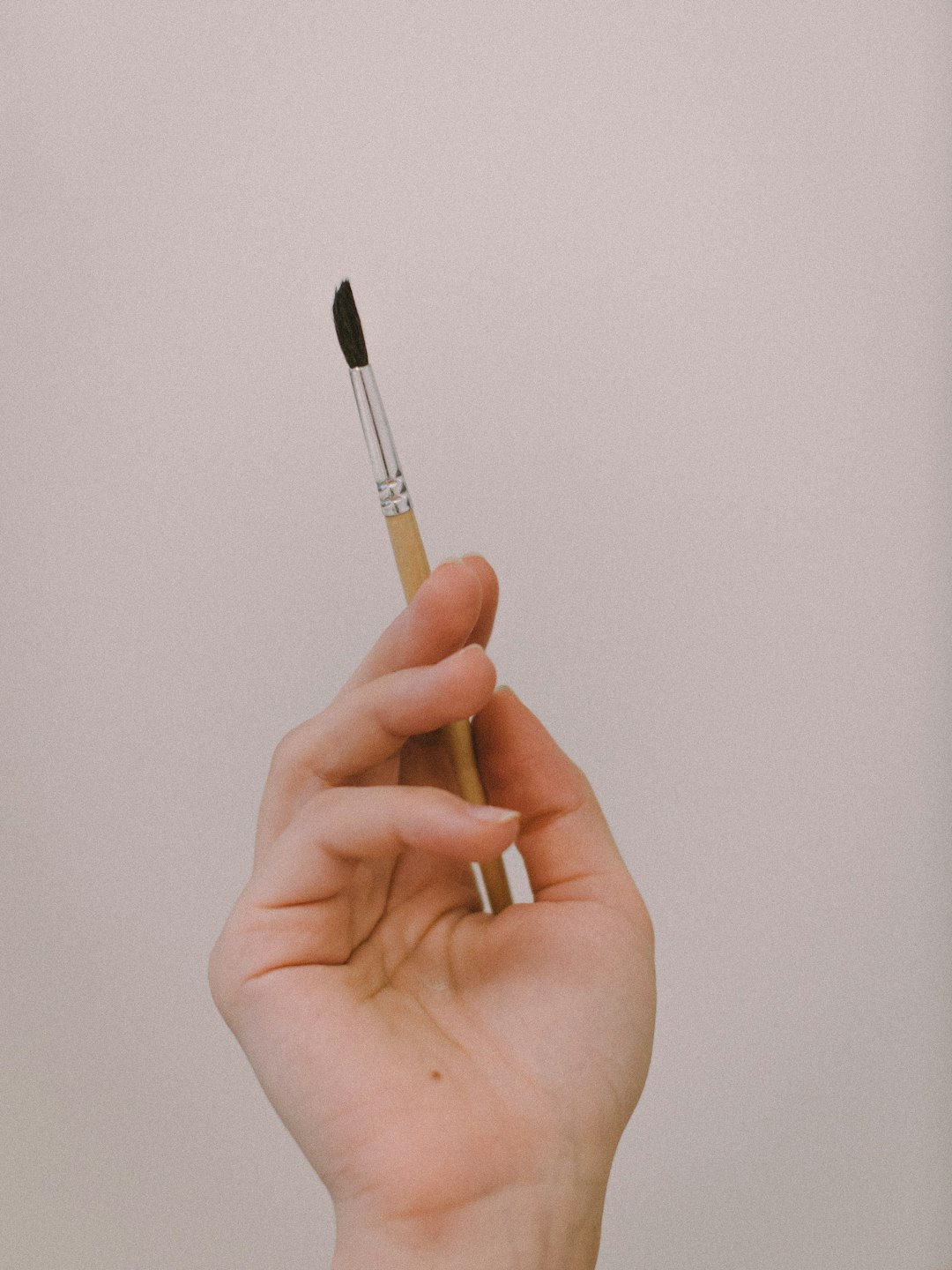 person holding black and white pen