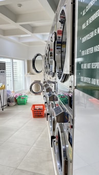 red plastic basket on white floor tiles