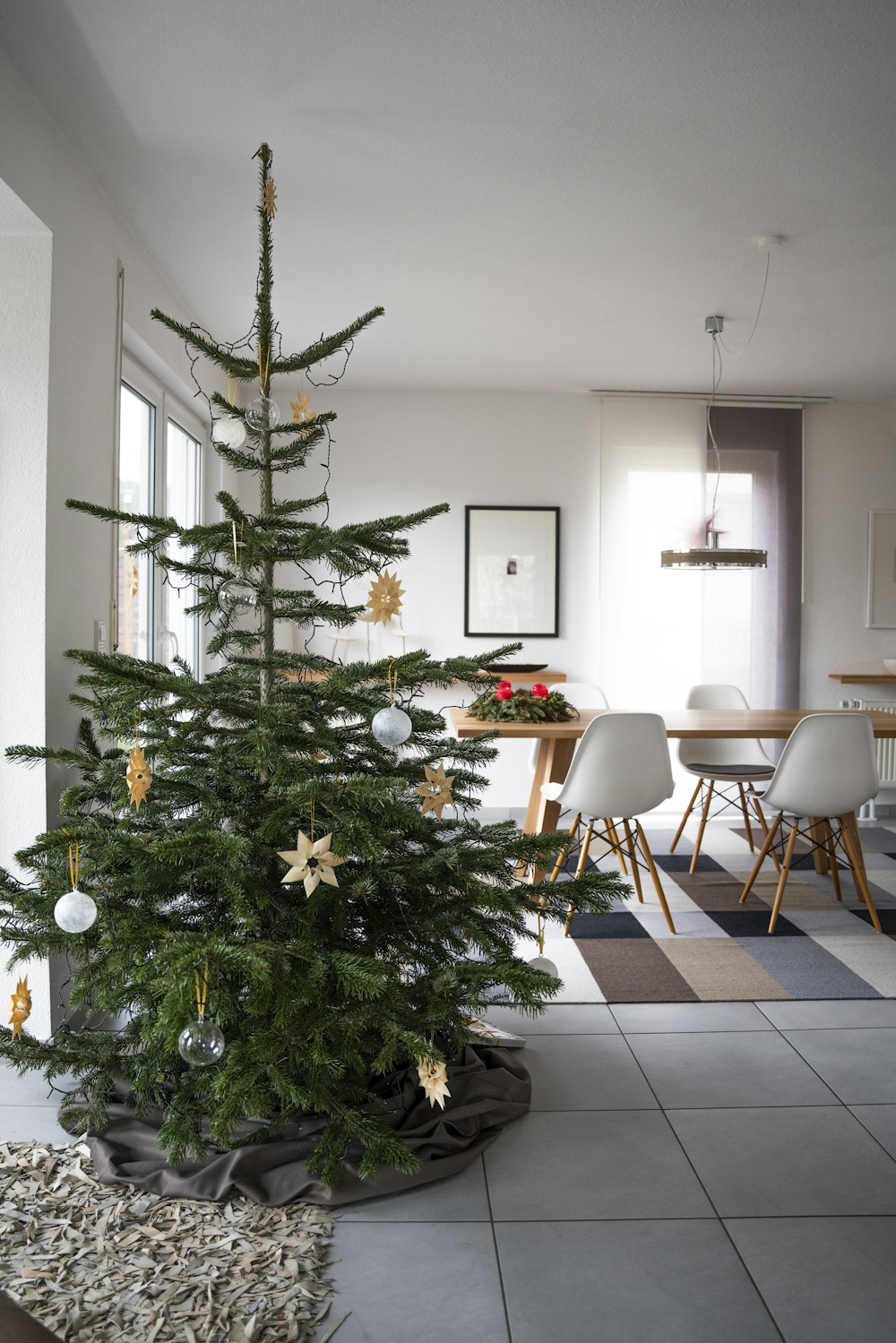 green christmas tree with baubles and string lights