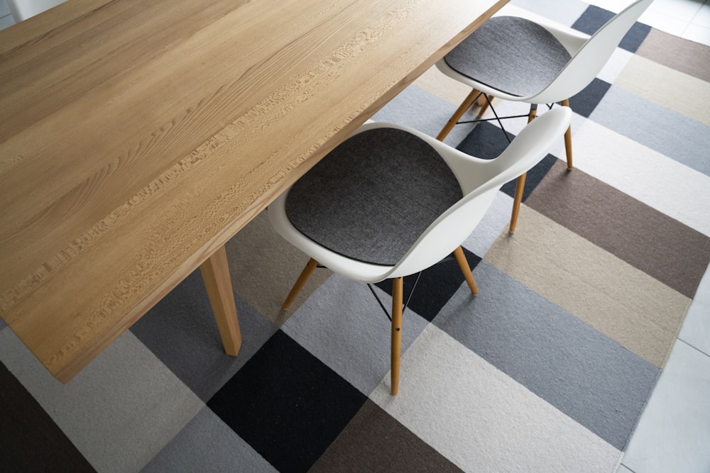 white and black chair beside brown wooden table