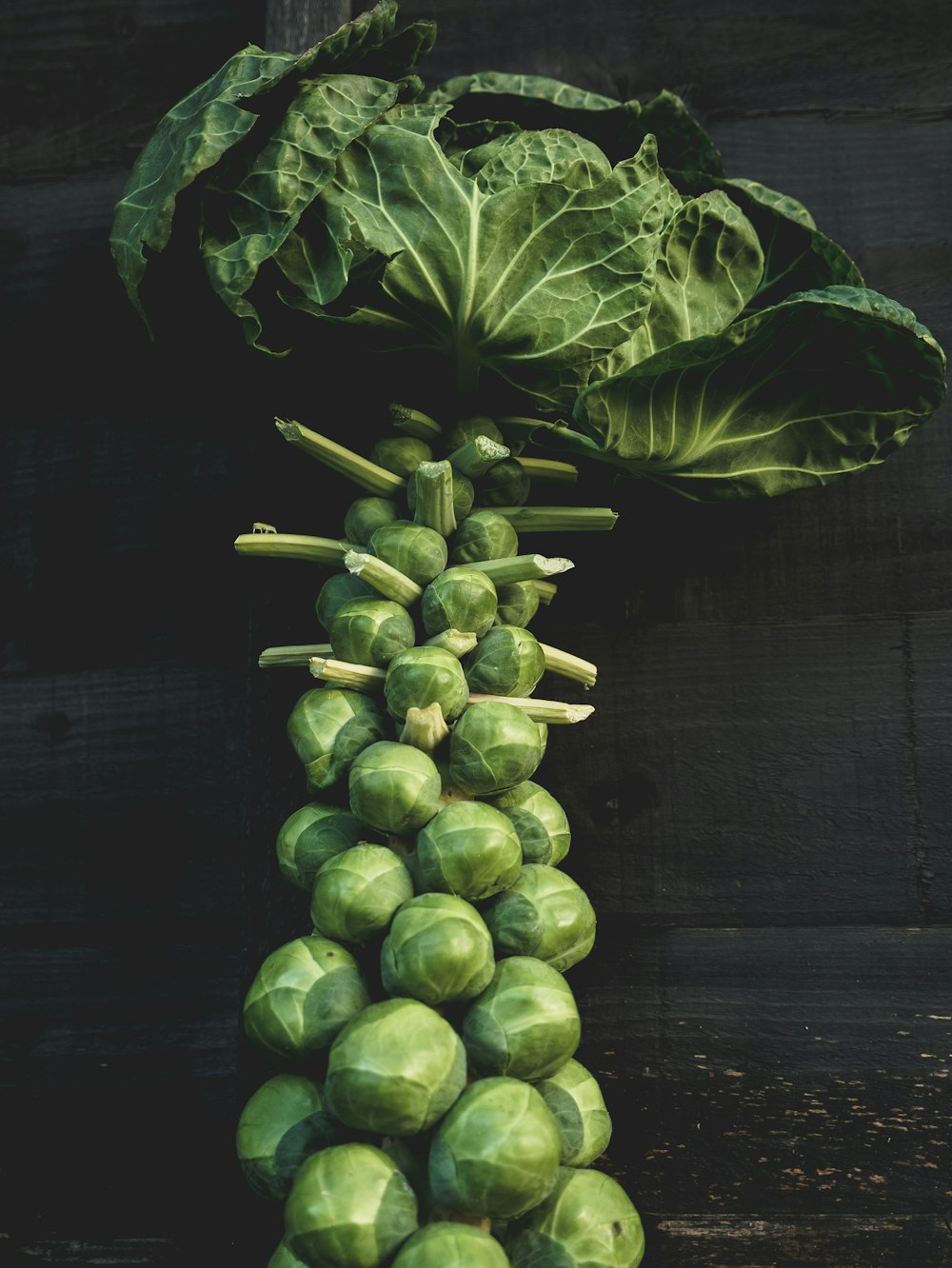 green vegetable on brown wooden table