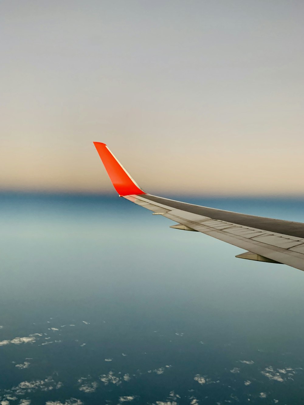 white and red airplane wing