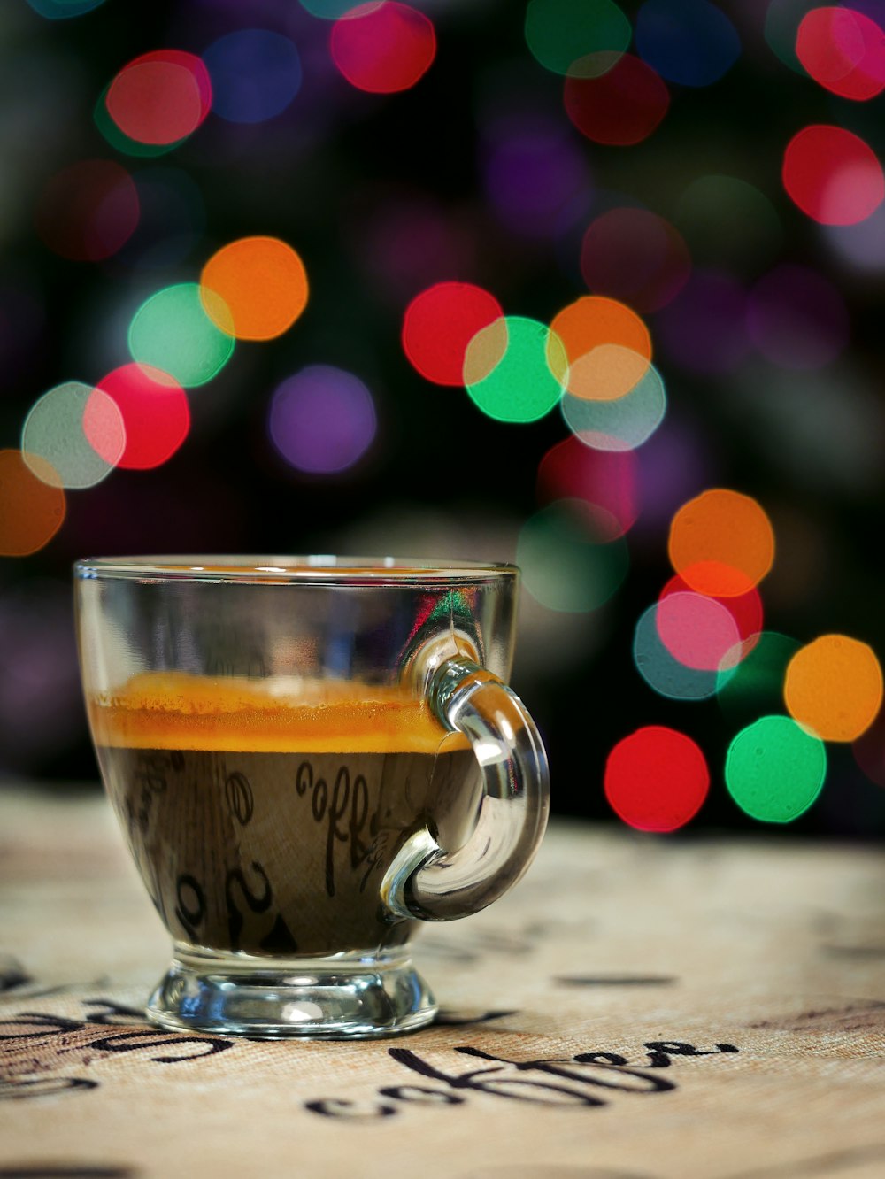 clear glass cup with brown liquid