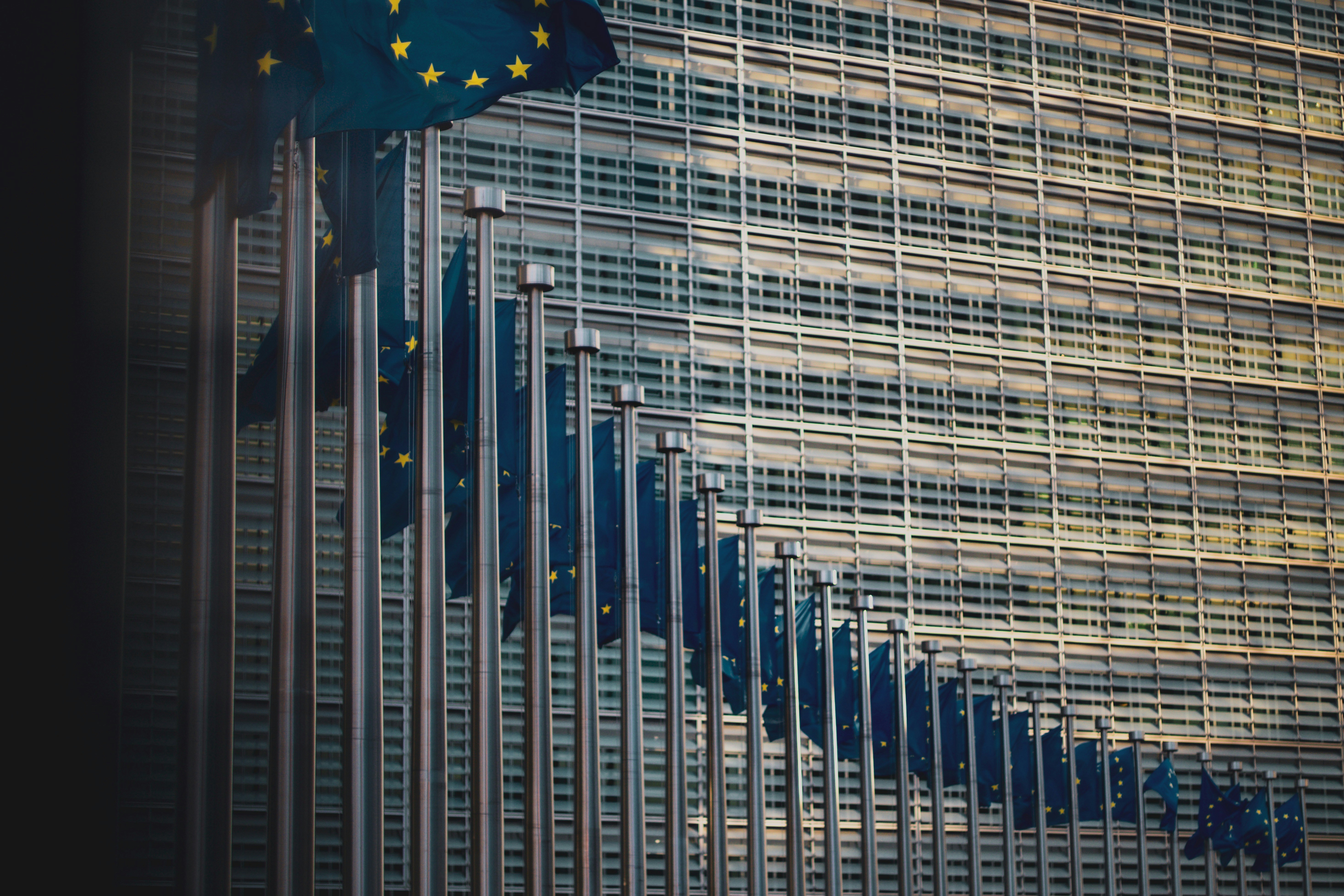 Flags of the member states of the European Union in front of the EU-commission building \