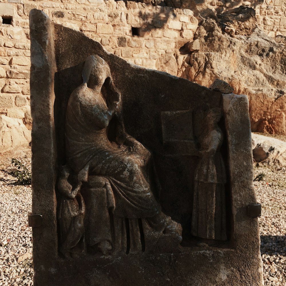 brown concrete statue during daytime