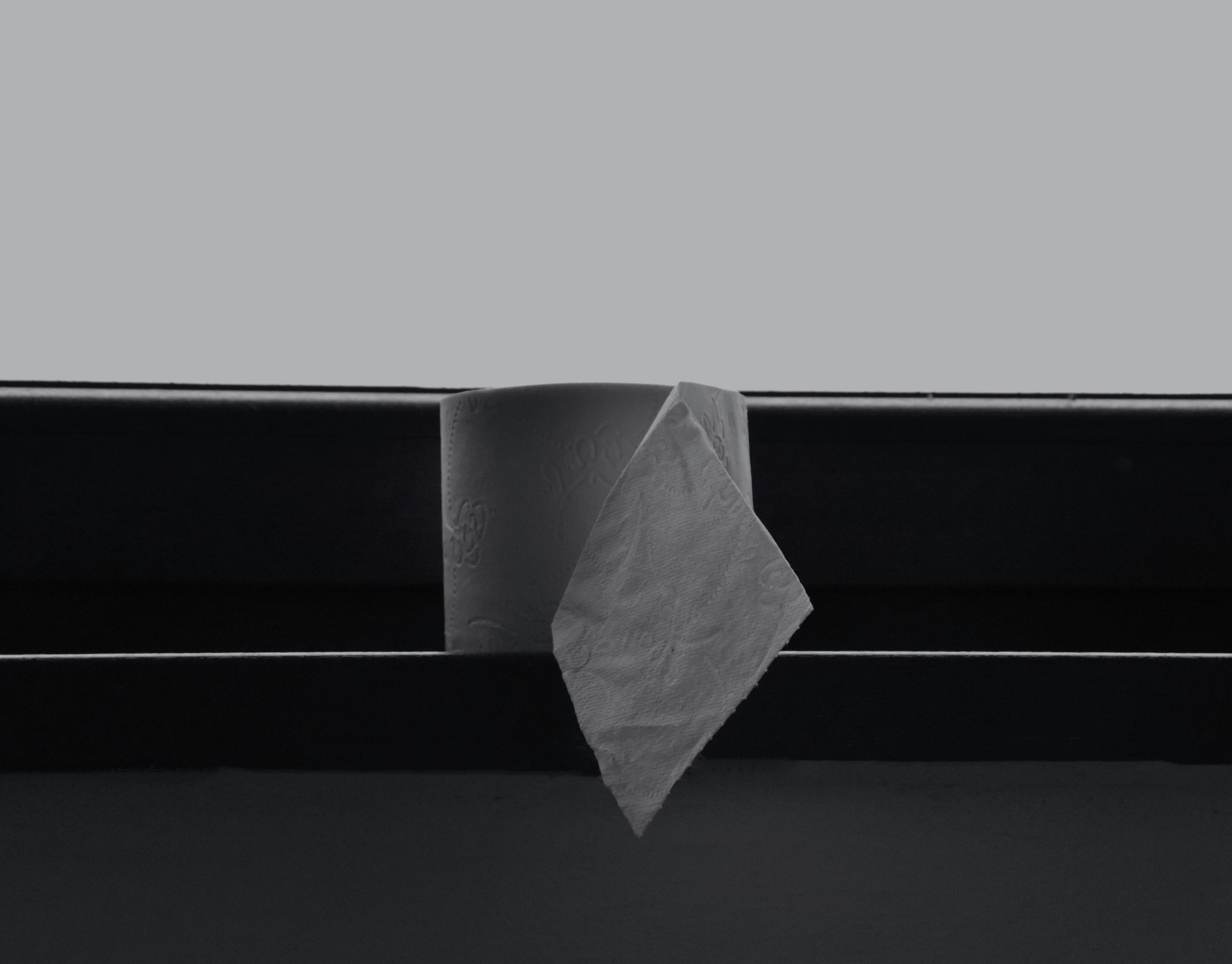 white paper on black surface