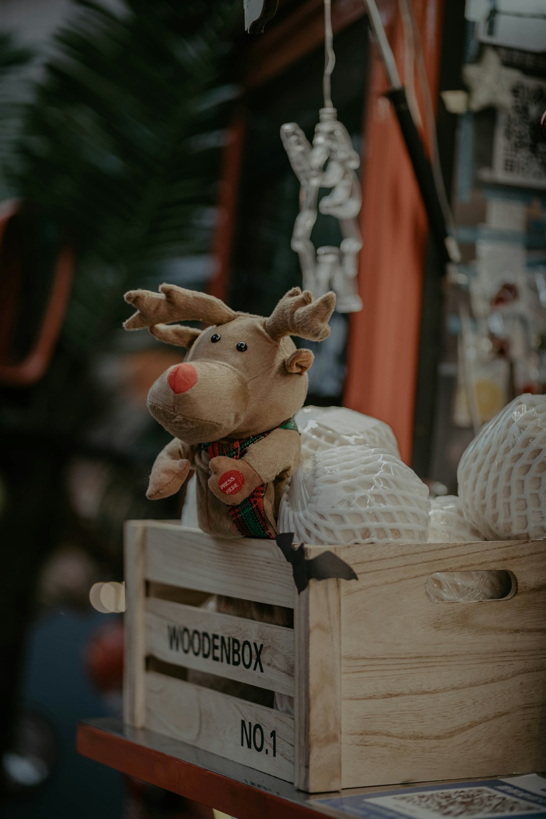 brown deer plush toy on brown wooden crate