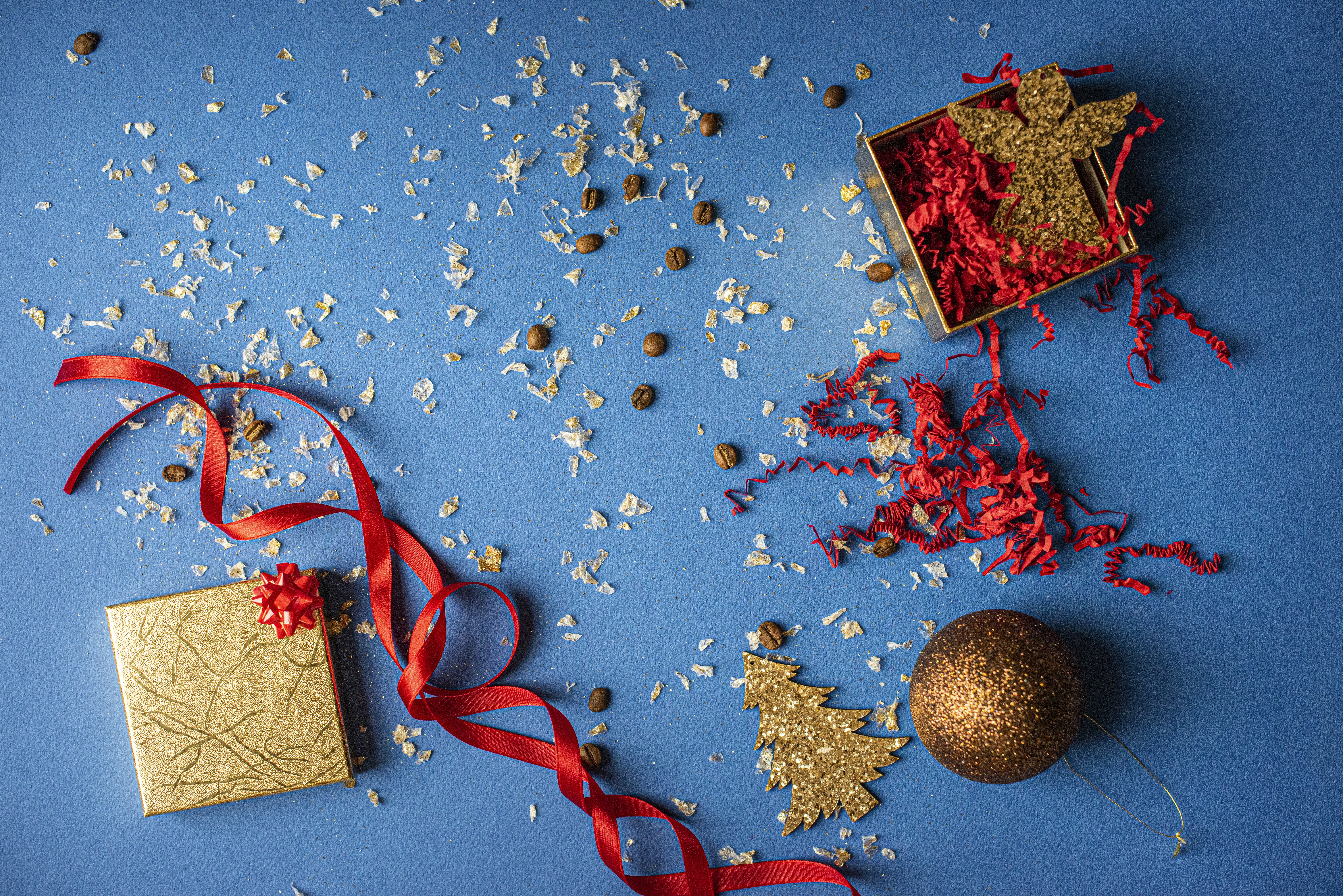 red and brown gift box on blue and white star print textile