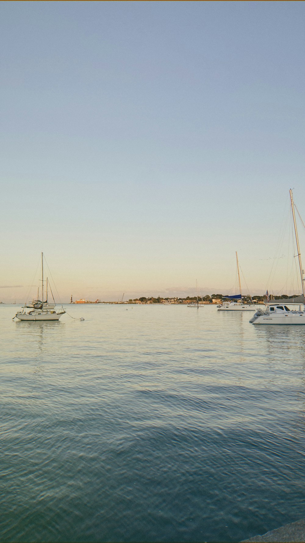 white boat on sea during daytime