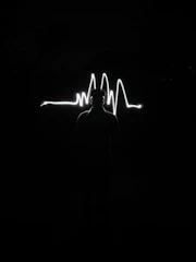 Soft pastel graphic showing a digital heartbeat line forming a mother’s profile.