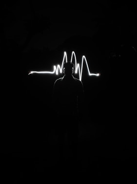 A vibrant training session in Oakland with a heartbeat EKG graphic overlay in black and gold.