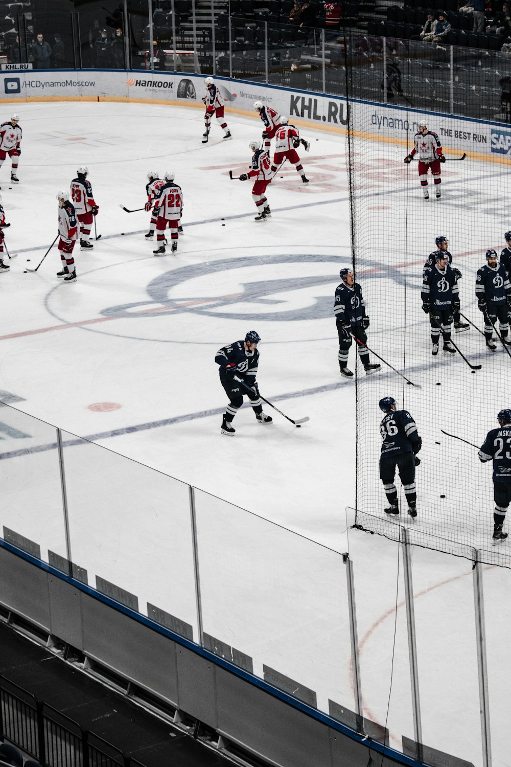 people playing ice hockey on ice field