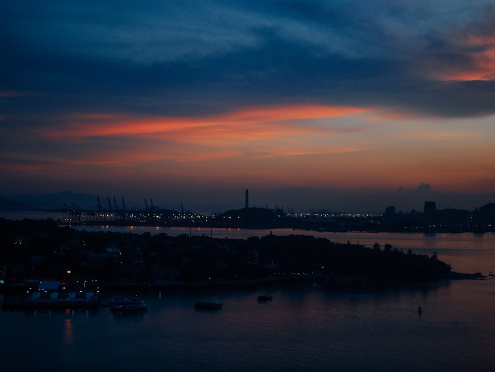 silhouette of city buildings during sunset