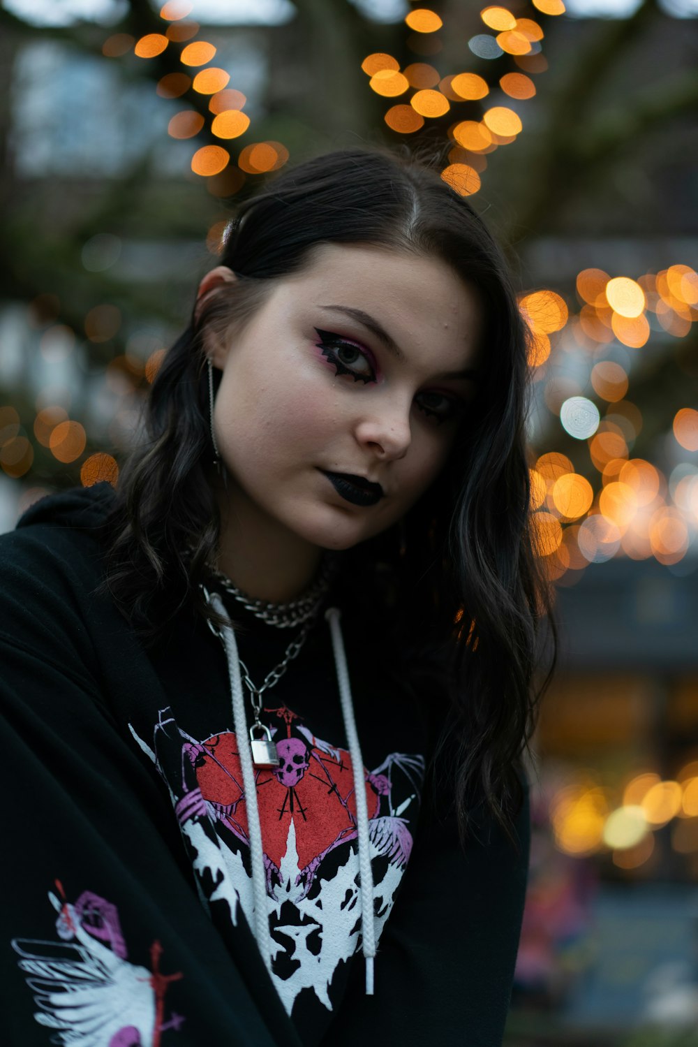 woman in black and pink floral long sleeve shirt