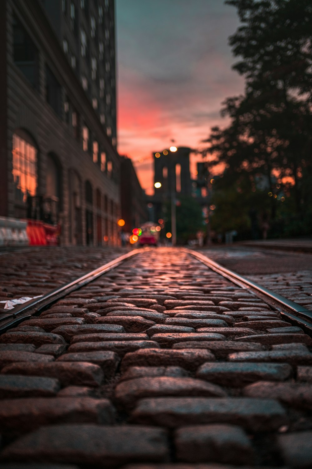 grey concrete road in between buildings during daytime