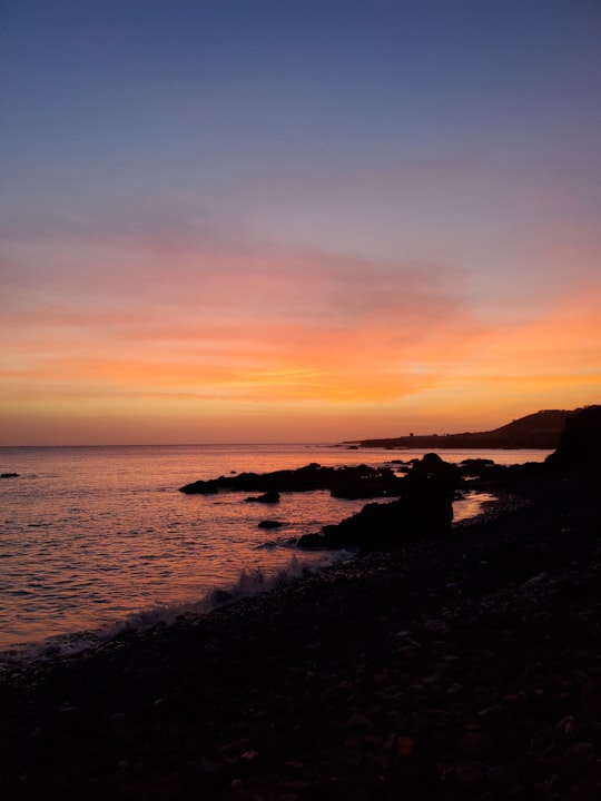 silhouette of rocks on sea during sunset in Cidade Velha Cape Verde