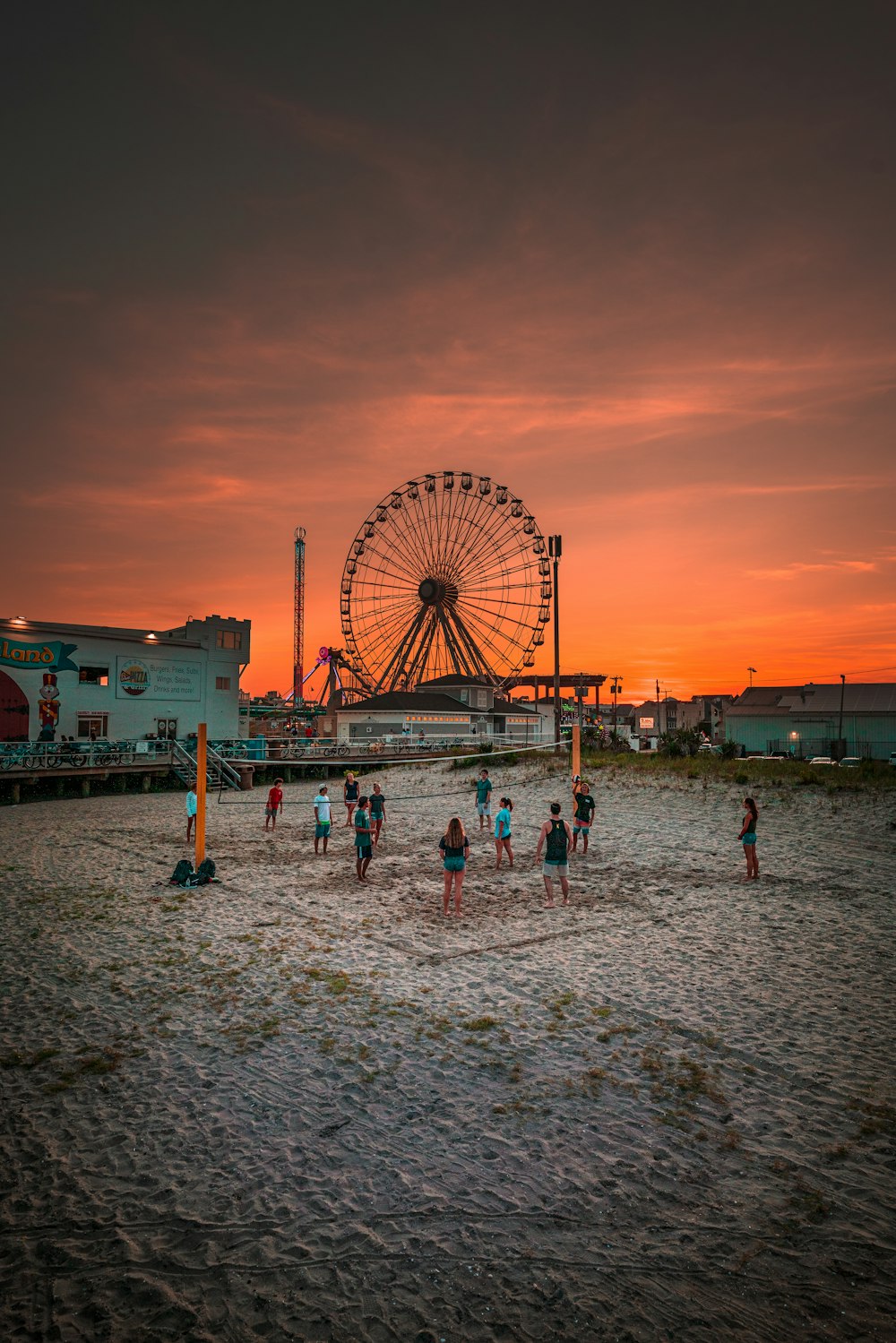 people on beach during sunset