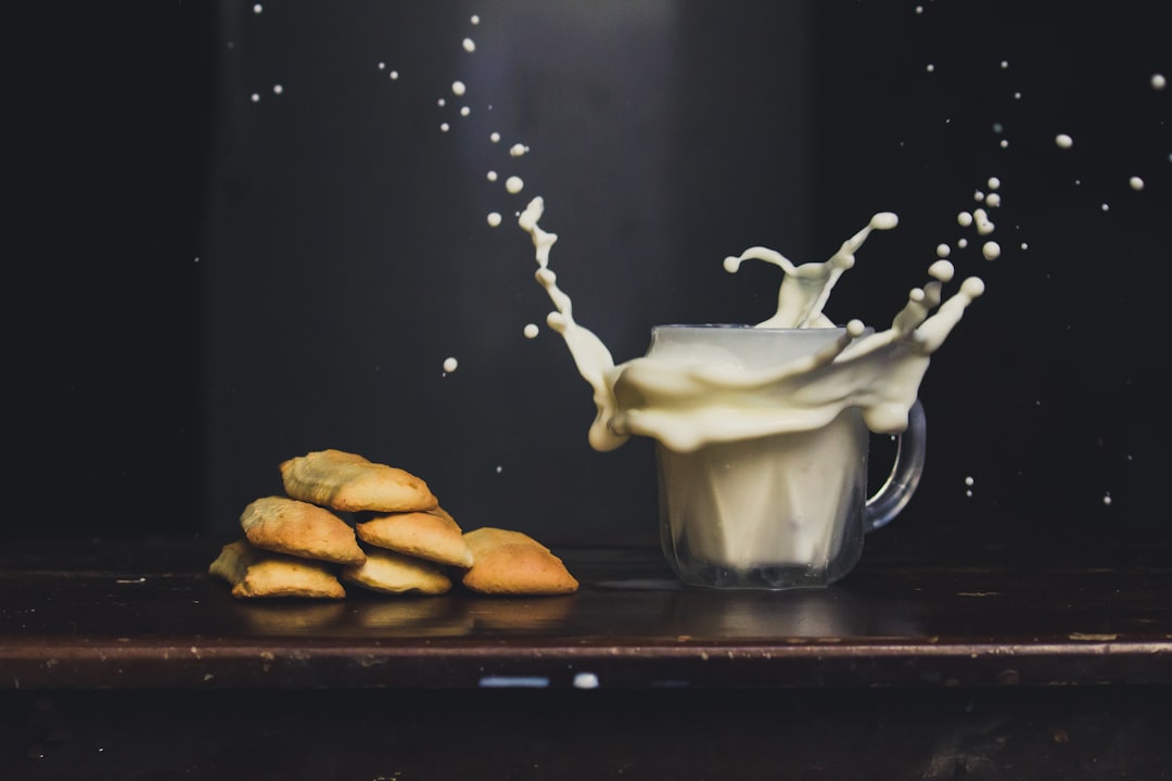 white ceramic mug on brown wooden table